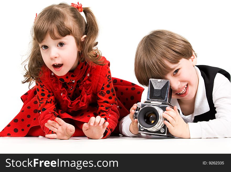 Adorable children taking pictures with photo camera. Adorable children taking pictures with photo camera