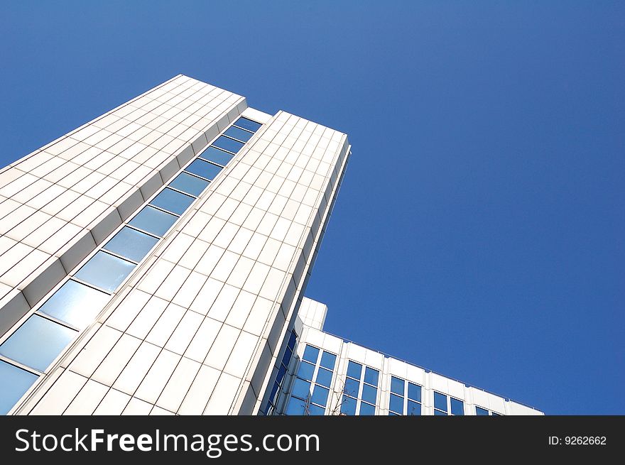 High white building and blue sky. High white building and blue sky