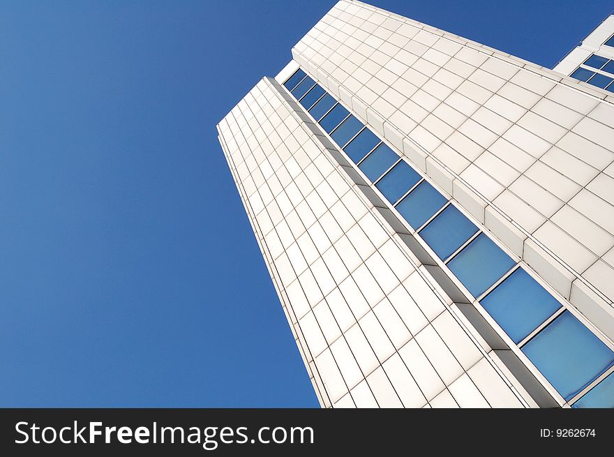 High white building and blue sky. High white building and blue sky