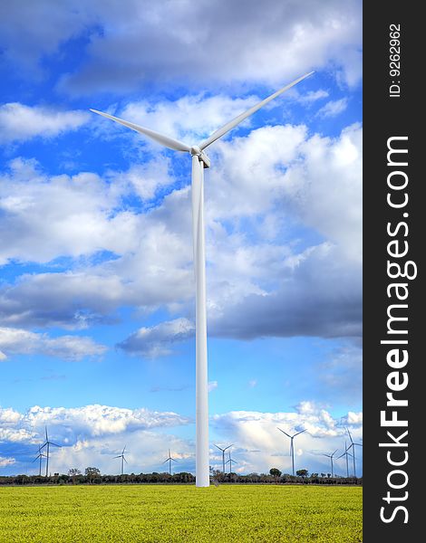 Windmills against a cloudy sky