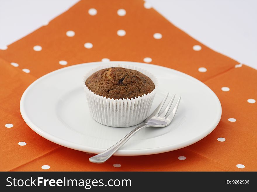 Fresh baked Muffin on a white dish