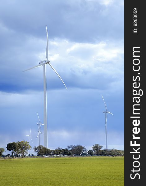 Windmills against a cloudy sky