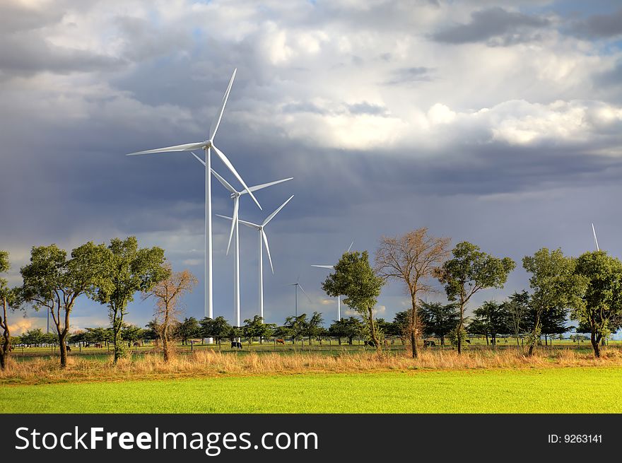 Windmills against a cloudy sky