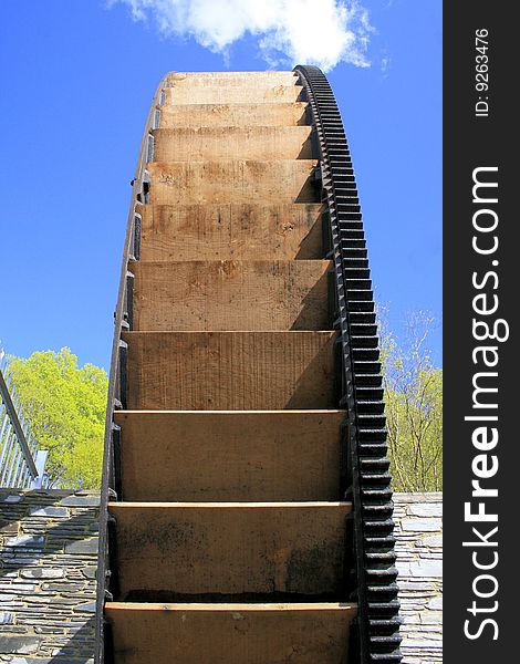 Water wheel in Ceredigion, mid Wales. Restored to provide green energy. Water wheel in Ceredigion, mid Wales. Restored to provide green energy