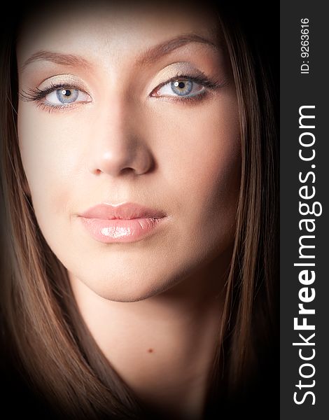 Portrait of attractive brown-haired girl. Strong vignetting on corners