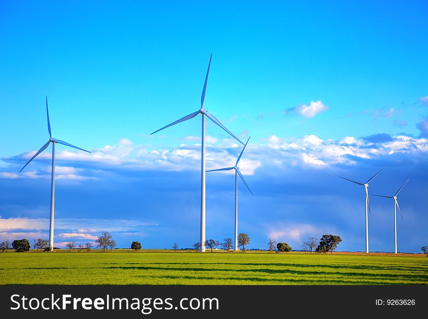 Windmills against a cloudy sky