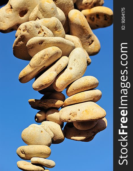 Accumulation of pebbles on the sea-sky background. Accumulation of pebbles on the sea-sky background