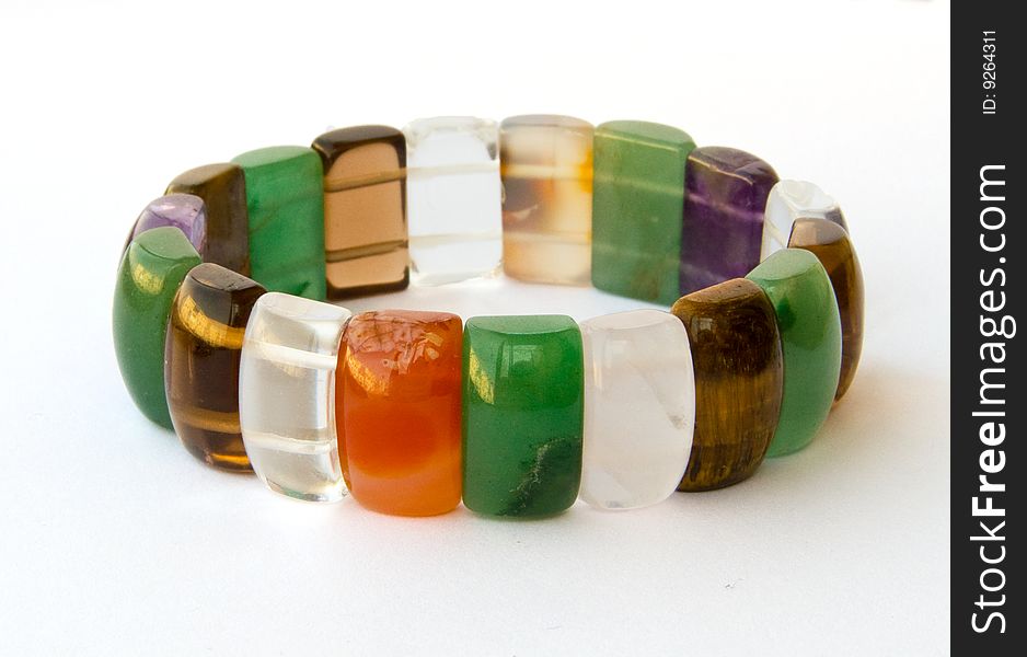 Multi-coloured bracelet on a white background