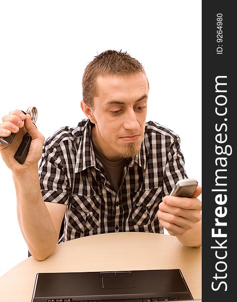 Man with phone working in office
