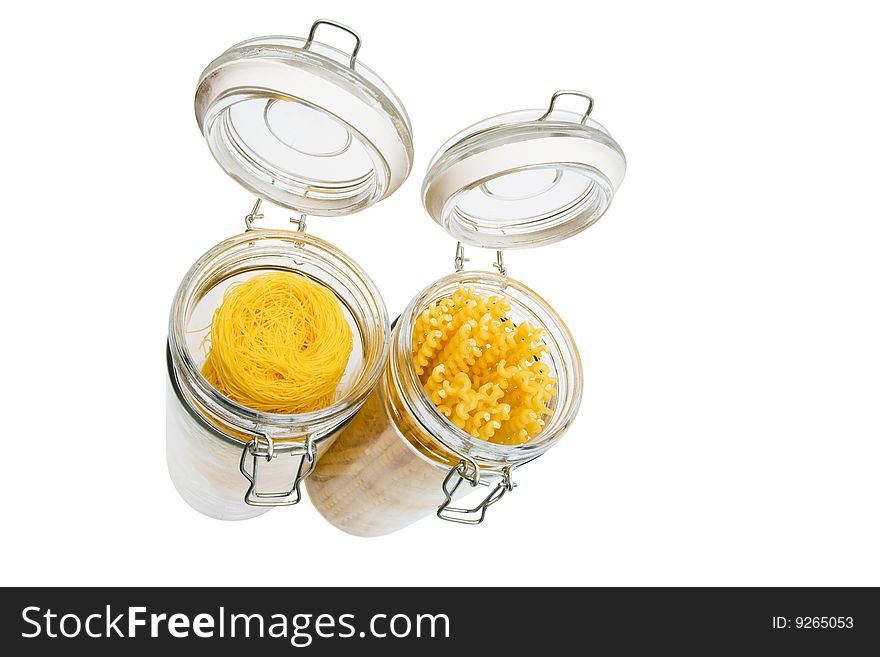 Pasta in glass can on a white background