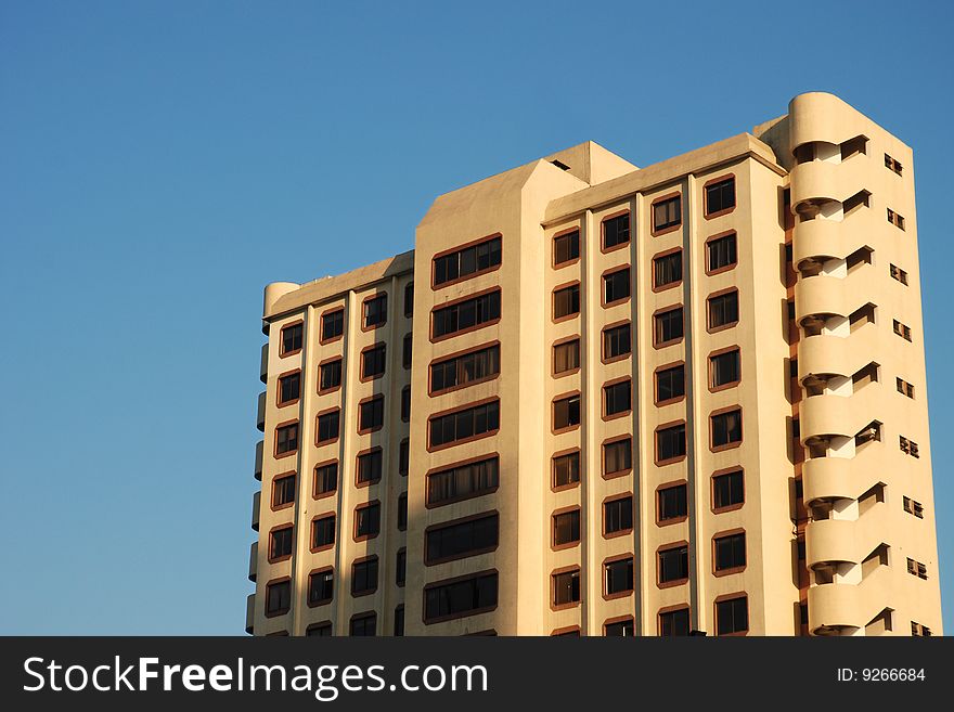 Old Apartment Building Against Blue Sky