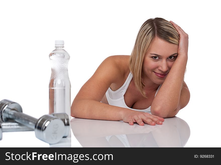 Blond woman with bottle of water and weights on white background. Blond woman with bottle of water and weights on white background