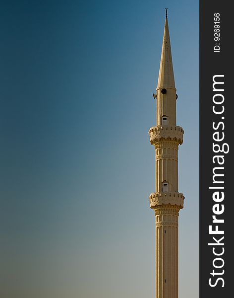 Minaret in Turkey, on the blue sky. Minaret in Turkey, on the blue sky