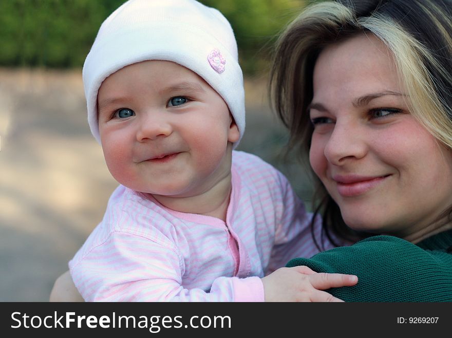 Portrait of happy mother and baby on the street. Portrait of happy mother and baby on the street