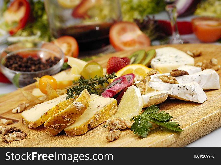 Cheese wood plate of various kind of cheese. Cheese wood plate of various kind of cheese