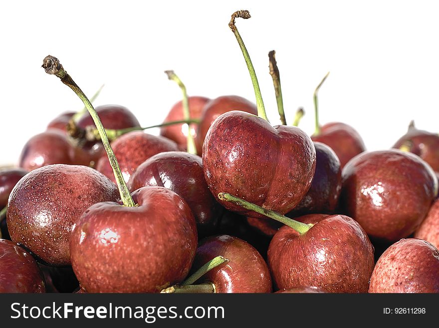 Red fresh cherries on white background close-up. Healthy food concept.