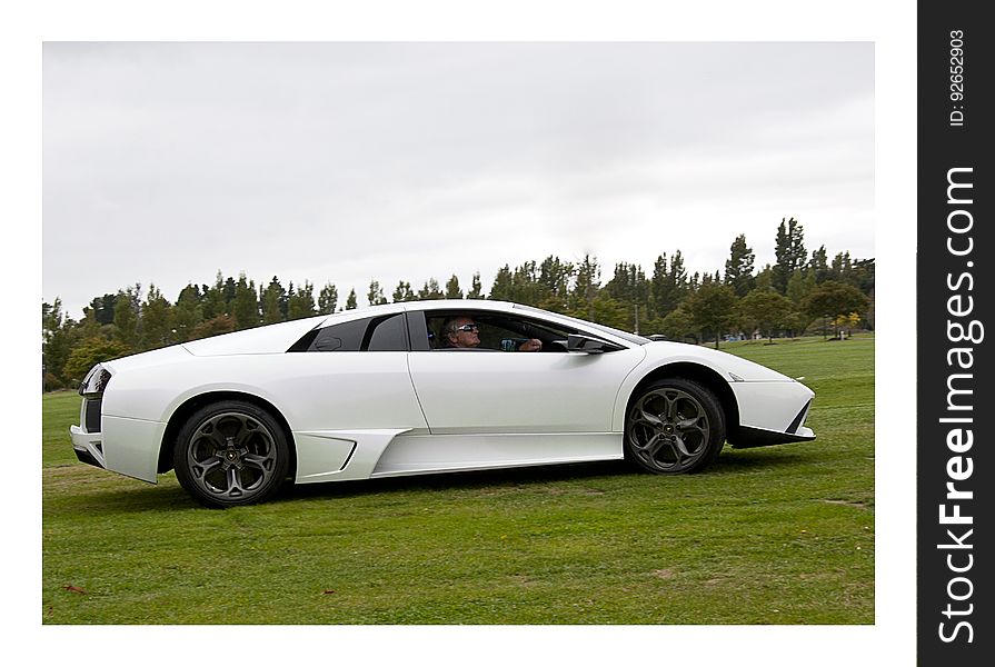 Christchurch,New Zealand - Mars 09,2014 Car enthusiast driving a Lamborghini Murcielago from 2008 in a classic car cavalcade the Twin Rivers Car Parade. The car parade is held every year in Christchurch in New Zealand