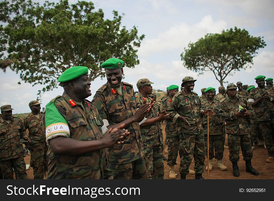 African Union Mission in Somalia &#x28;AMISOM&#x29; Force Commander Lt. Gen. Andrew Gutti &#x28;left&#x29; gestures with Brigadier Paul Lokech, Commander for the Ugandan Contigent serving with the AU operation during the recital of a patriotic song sung by Ugandan soldiers 5 June in Afgoye located 30km to the west of the Somali capital Mogadishu. AMISOM supporting Somali National Army &#x28;SNA&#x29; forces recently liberated the Afgoye Corridor from the Al Qaeda-affiliated extremist group Al Shabaab, pushing them further away from Mogadishu and opening up the free flow of goods and produce between the fertile agricultural area surrounding Afgoye and the Somali capital. AU-UN IST PHOTO / STUART PRICE. African Union Mission in Somalia &#x28;AMISOM&#x29; Force Commander Lt. Gen. Andrew Gutti &#x28;left&#x29; gestures with Brigadier Paul Lokech, Commander for the Ugandan Contigent serving with the AU operation during the recital of a patriotic song sung by Ugandan soldiers 5 June in Afgoye located 30km to the west of the Somali capital Mogadishu. AMISOM supporting Somali National Army &#x28;SNA&#x29; forces recently liberated the Afgoye Corridor from the Al Qaeda-affiliated extremist group Al Shabaab, pushing them further away from Mogadishu and opening up the free flow of goods and produce between the fertile agricultural area surrounding Afgoye and the Somali capital. AU-UN IST PHOTO / STUART PRICE.