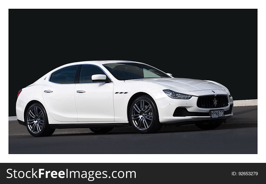 MASERATI GHIBLI from 2014 is parked on a street in the centaral of Christchurch,New Zealand. MASERATI GHIBLI from 2014 is parked on a street in the centaral of Christchurch,New Zealand