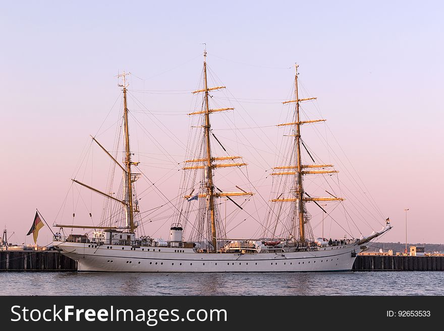 Gorch Fock, a tall ship of the German Navy in the harbor at sunset. Gorch Fock, a tall ship of the German Navy in the harbor at sunset.