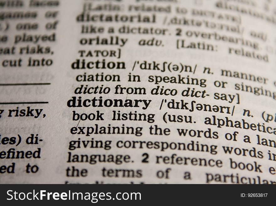 Closeup of the definition of a dictionary. Closeup of the definition of a dictionary.