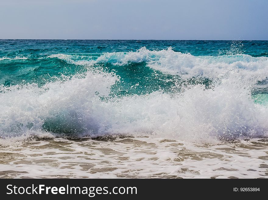 Waves breaking on the shore on the seacoast.