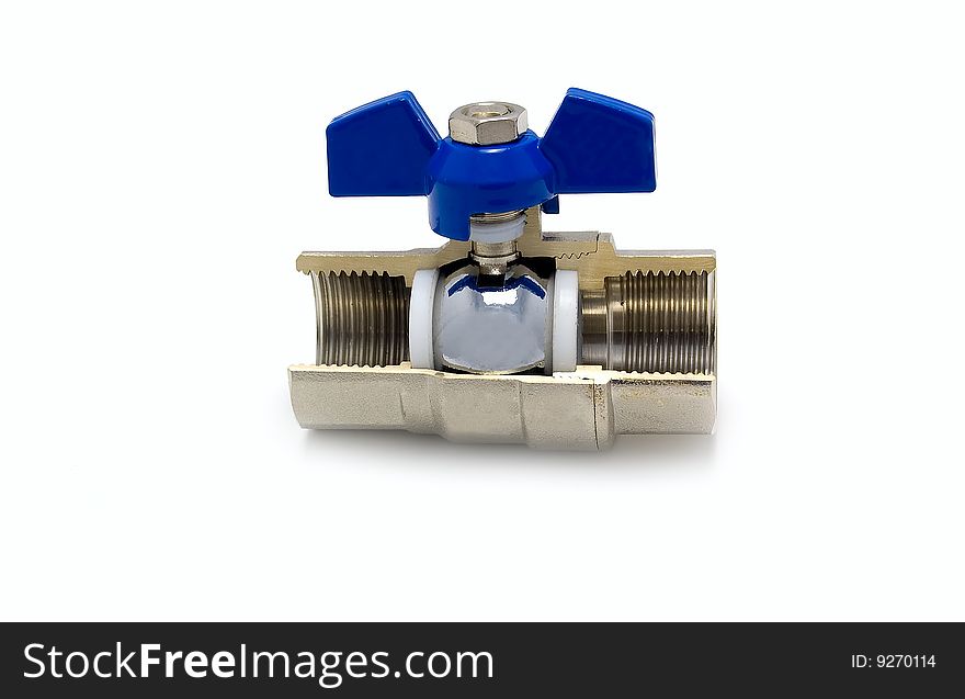 The water valve with the dark blue handle in a cut. White background. The water valve with the dark blue handle in a cut. White background.