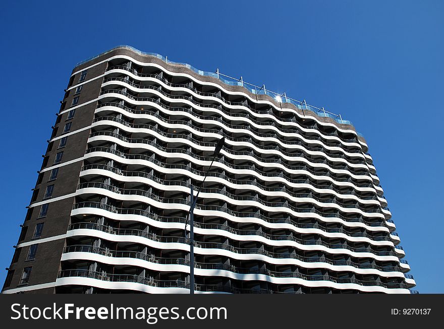 Modern Apartment Building over blue sky