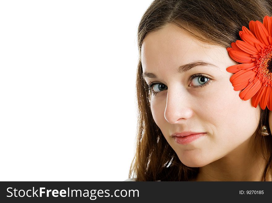 Beautiful woman with a bright red flower