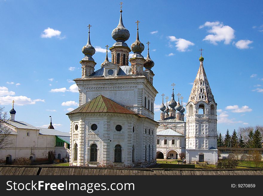 Church on a background of the blue sky with a cloud. Russia, Yur'ev-Polskiy