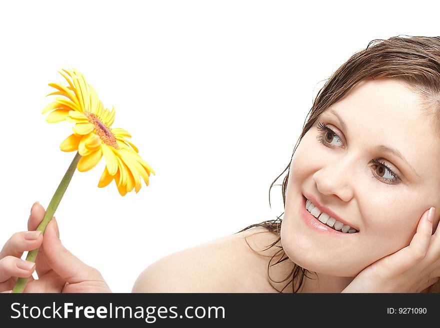 Smiling woman holding gerber flower