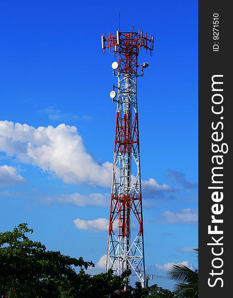 Cellular communication tower on a bright sunny day. Cellular communication tower on a bright sunny day