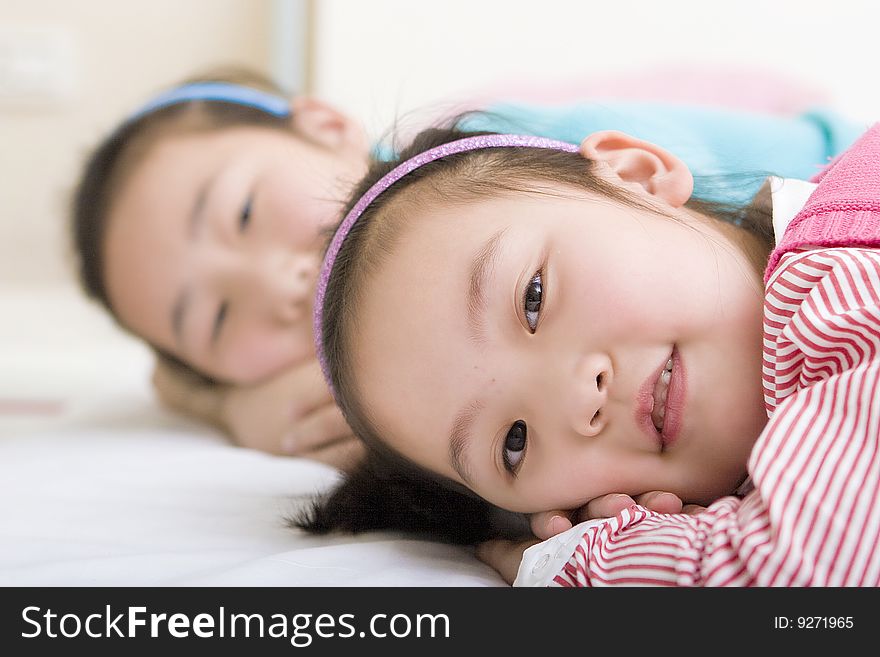 Two little girls play game together. Two little girls play game together.