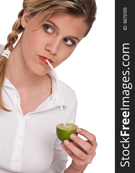 Woman holding lime with straw on white background. Woman holding lime with straw on white background