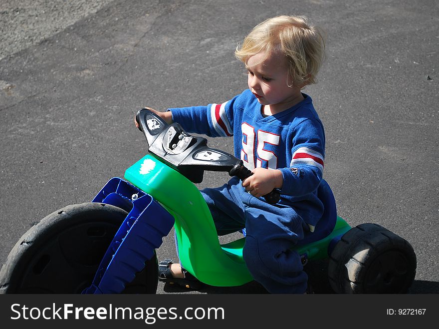 Young boy enjoying his bike. Young boy enjoying his bike