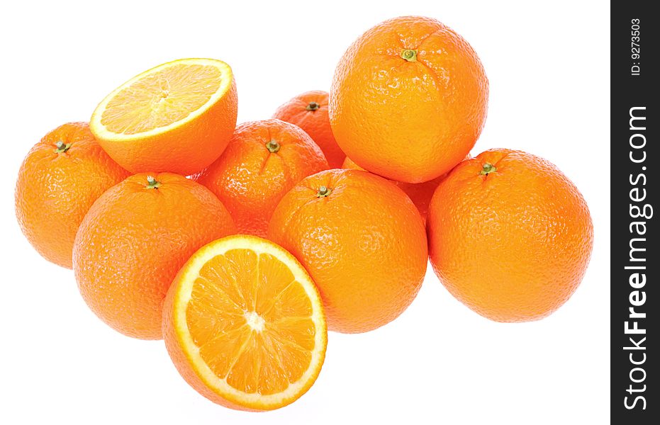 Bunch of Fresh oranges. One cut on half. Isolated on white background.