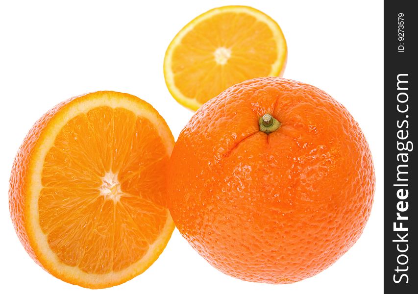 Fresh oranges. One cut on half. Isolated on white background. Fresh oranges. One cut on half. Isolated on white background.