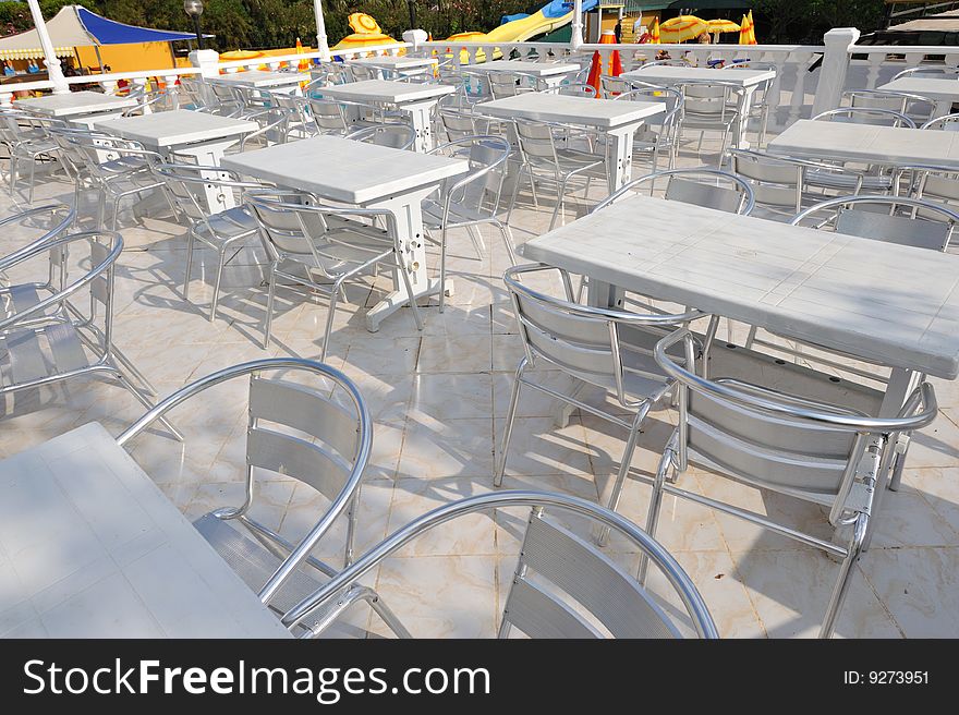 Empty street cafe with plastic tables