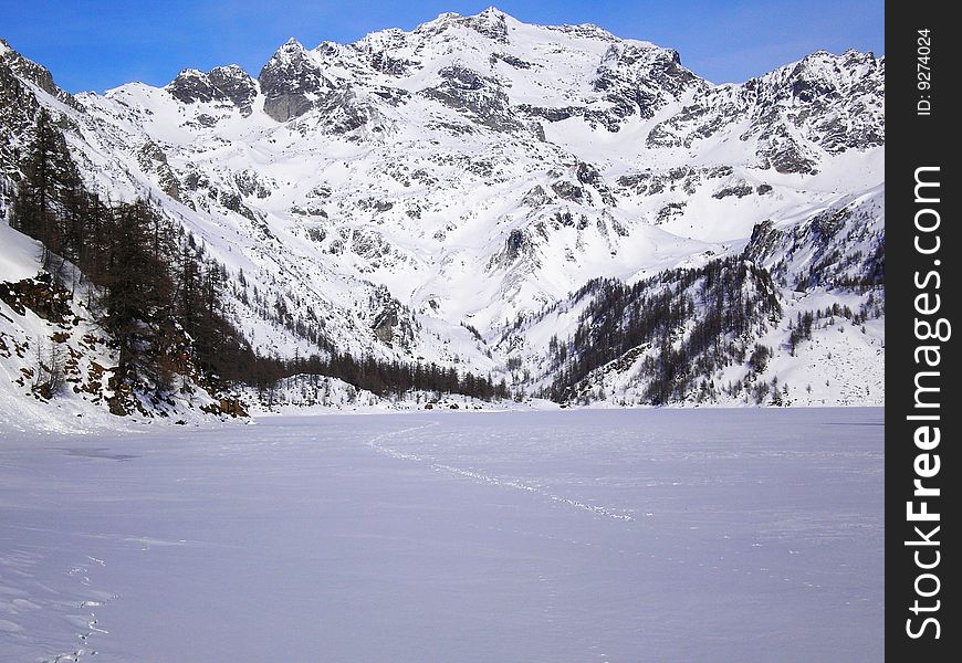 Walking on ice crust of a lake in winter. Walking on ice crust of a lake in winter