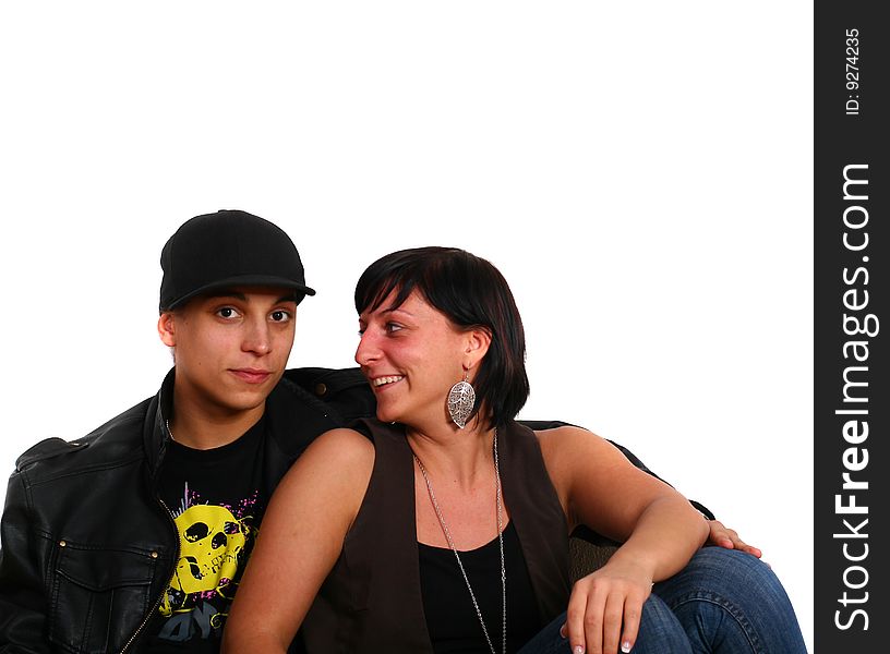 Young stylish couple sitting on the floor! Isolated over white. Young stylish couple sitting on the floor! Isolated over white.