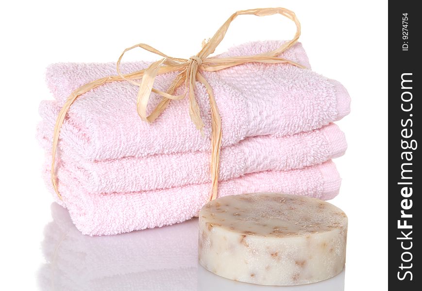 Pink towelettes with a bar of oatmeal soap. Pink towelettes with a bar of oatmeal soap