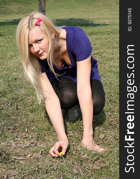 Girl holding a tiny flower in her hands. Girl holding a tiny flower in her hands