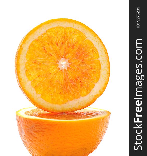 Slice of orange on white background macro