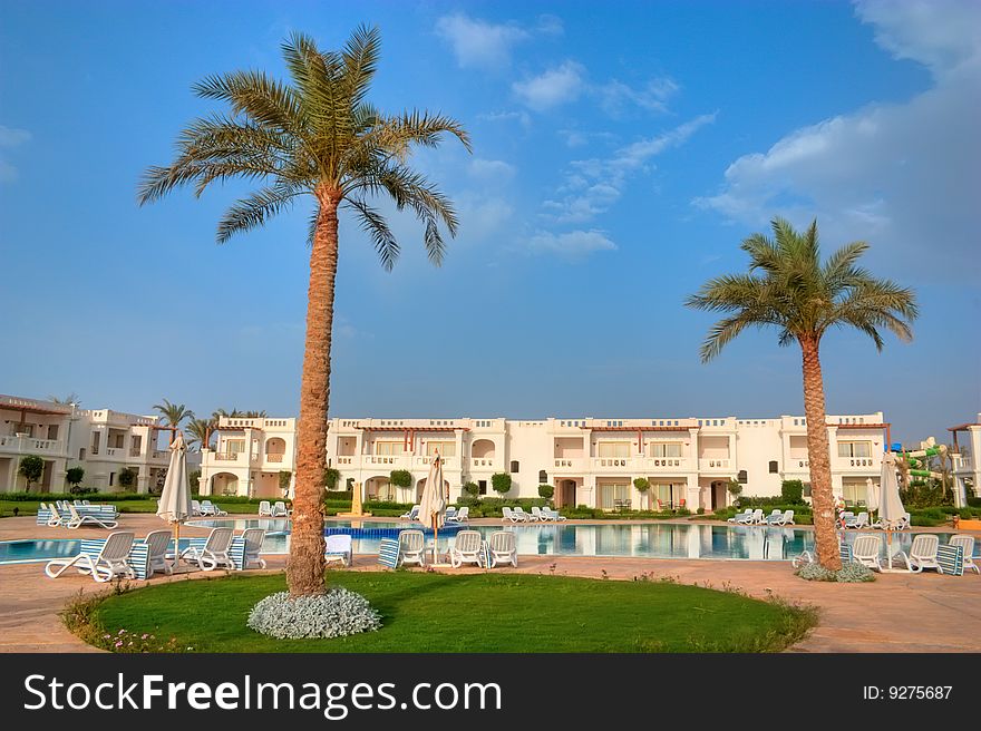 Swimming pool with blue water in tropical hotel. Swimming pool with blue water in tropical hotel