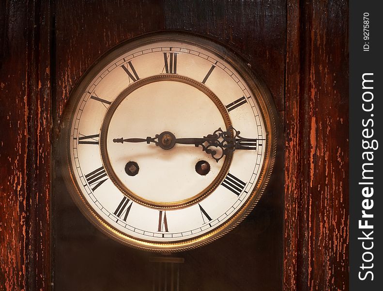 Antique clock with white dial