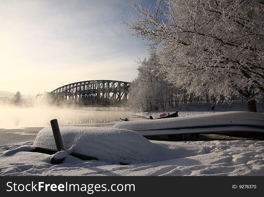 Very cold day, view over a river and bridge