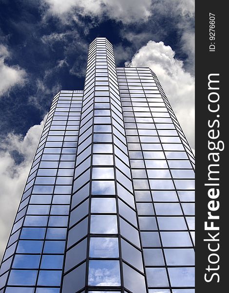 Office Building Skyscraper with Blue Sky Background