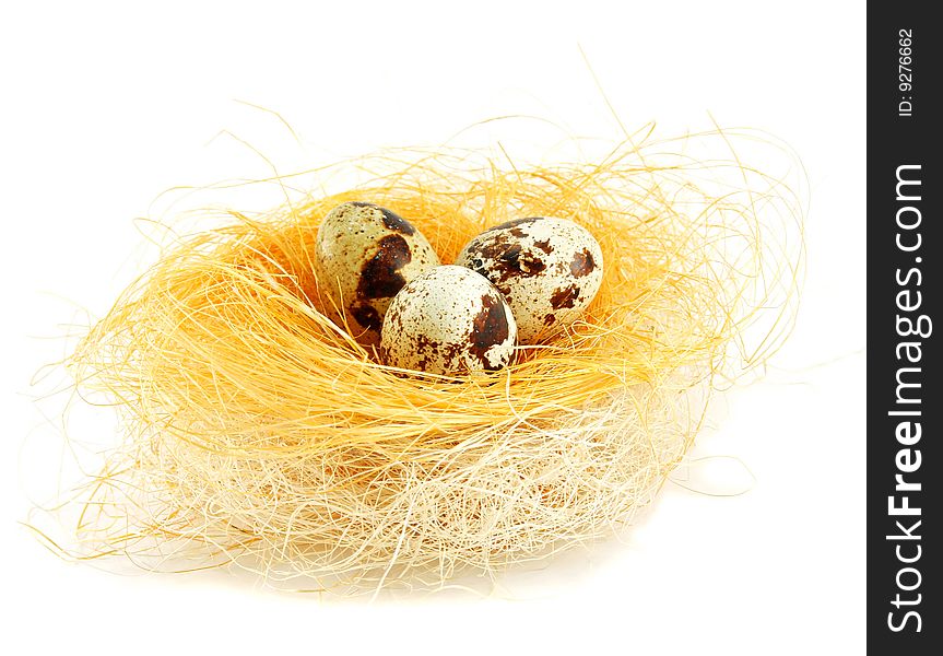 Eggs in a nest isolated on a white background
