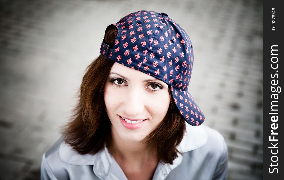 Beauty Woman With Baseball Cap. Close-Up Portrait. Beauty Woman With Baseball Cap. Close-Up Portrait