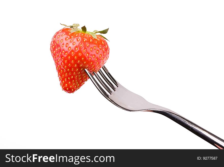 Strawberry close-up on a fork